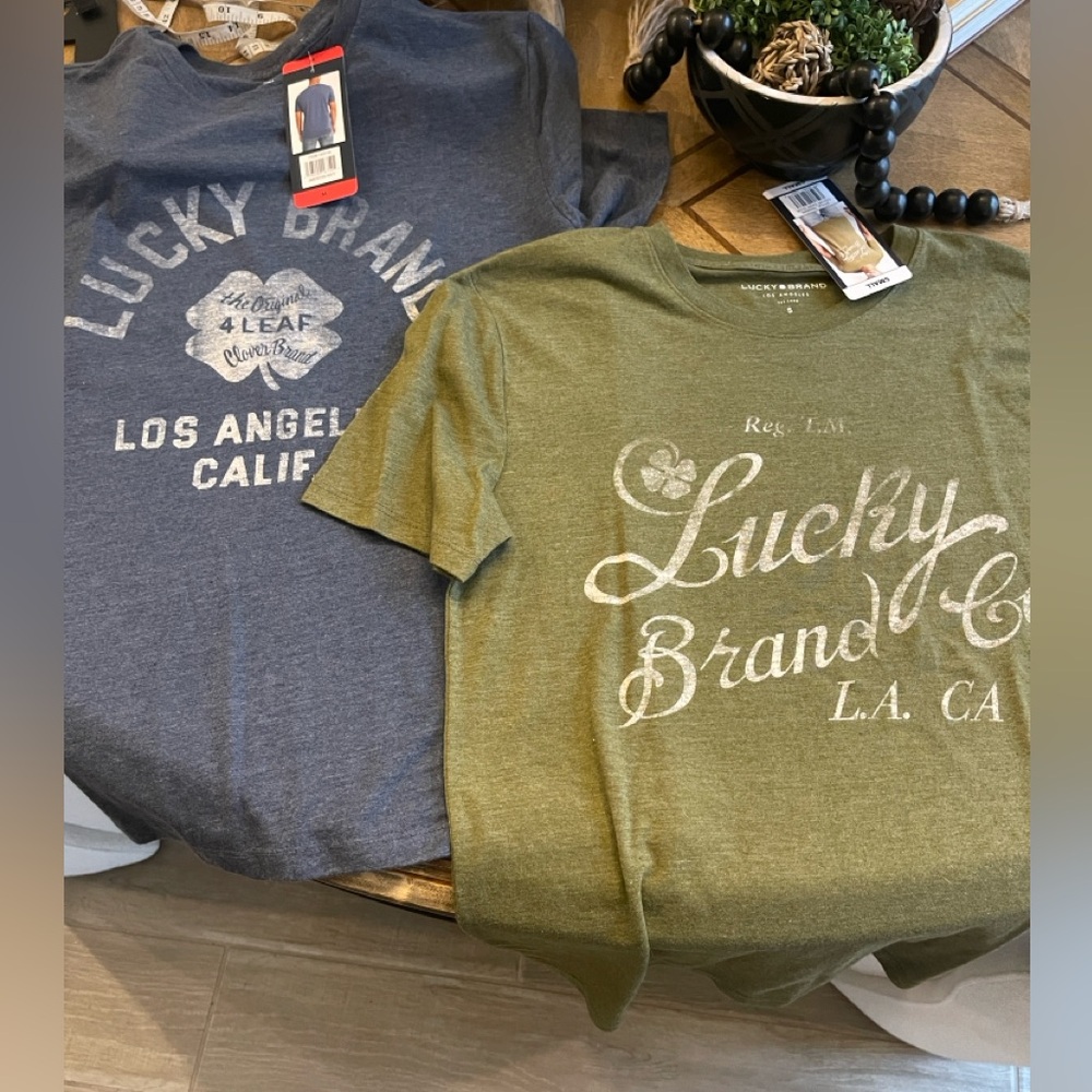 2 Men’s Lucky Brand shirts 1 size small and 1 size medium NWT